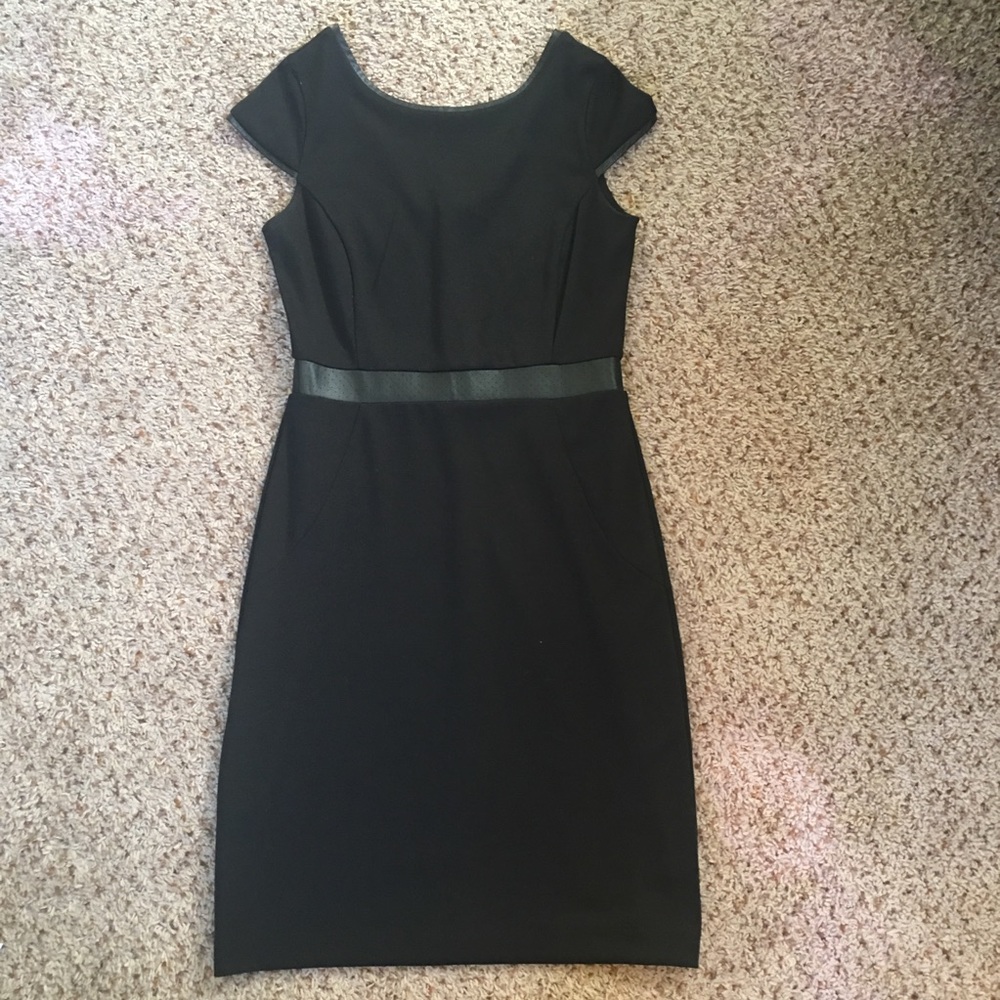 the limited  black dress with leather trim